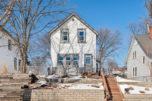 view of front of house featuring fence