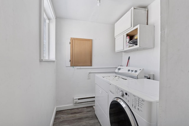 washroom featuring baseboards, cabinet space, dark wood-style flooring, a baseboard heating unit, and washer and clothes dryer