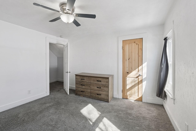 unfurnished bedroom with carpet flooring, baseboards, and ceiling fan