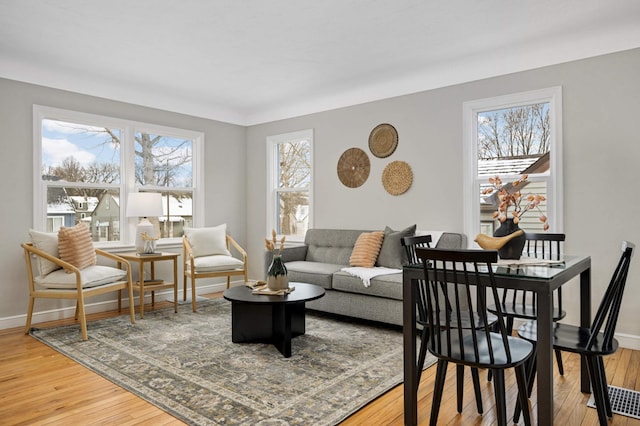 living room with a wealth of natural light and hardwood / wood-style floors