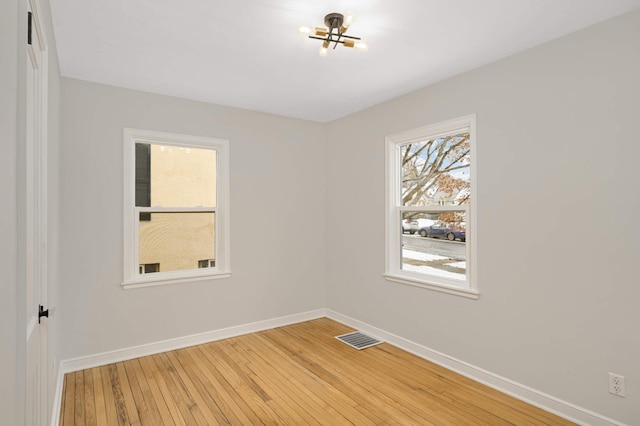 spare room featuring hardwood / wood-style floors