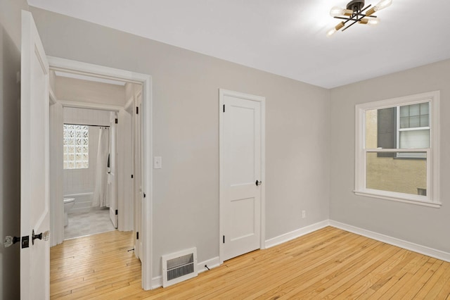 unfurnished room featuring light hardwood / wood-style floors