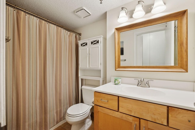 bathroom featuring vanity, a textured ceiling, toilet, and a shower with shower curtain