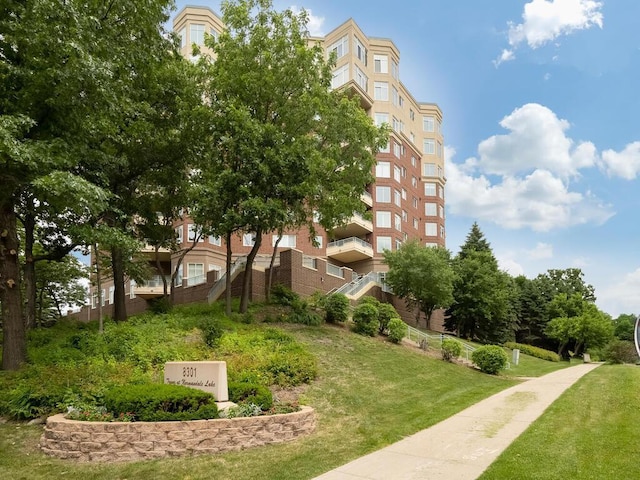 view of community featuring a lawn