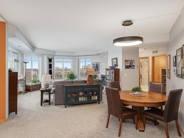 dining area with light carpet