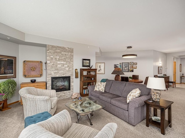 carpeted living room featuring a stone fireplace