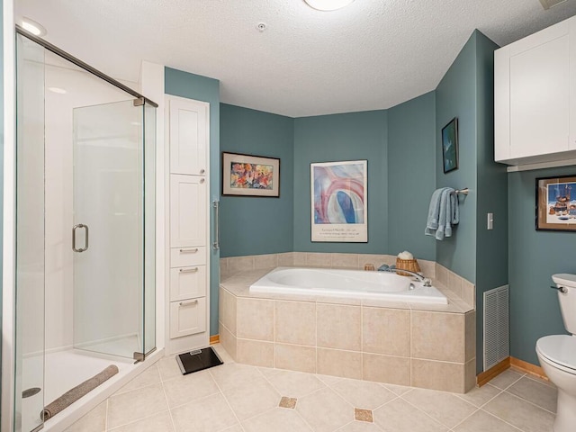 bathroom featuring toilet, independent shower and bath, tile patterned flooring, and a textured ceiling