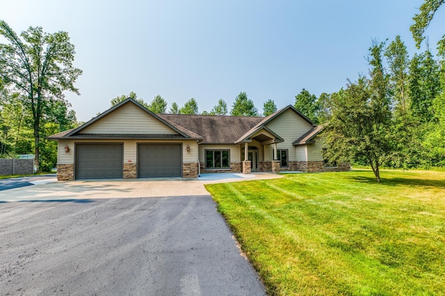 view of front of house featuring a front yard and a garage