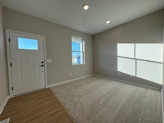 entryway with hardwood / wood-style flooring