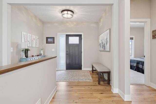 foyer entrance with light wood-type flooring