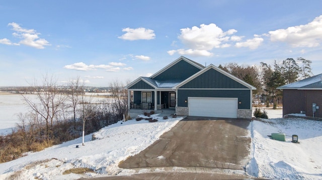 view of front facade with a garage and covered porch