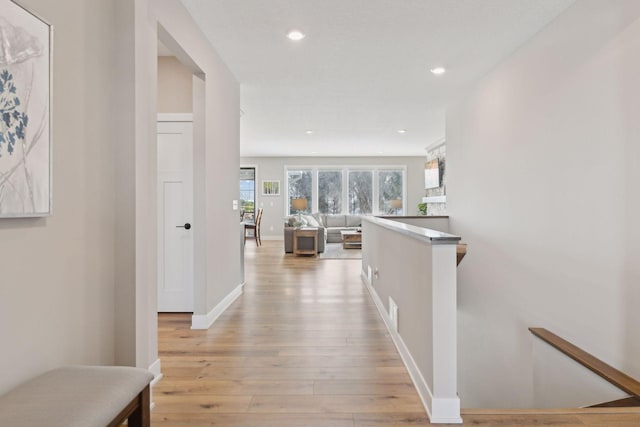 hallway with light wood-type flooring