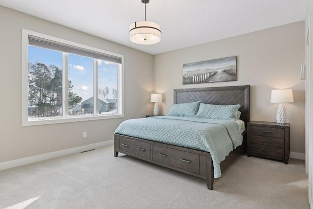 bedroom featuring light colored carpet