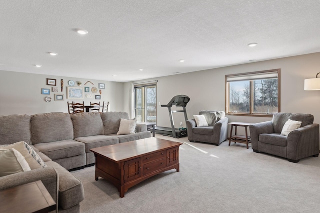 living room with light colored carpet and a textured ceiling