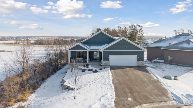 view of front of house with a garage and covered porch