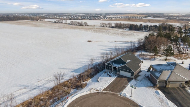 snowy aerial view featuring a rural view