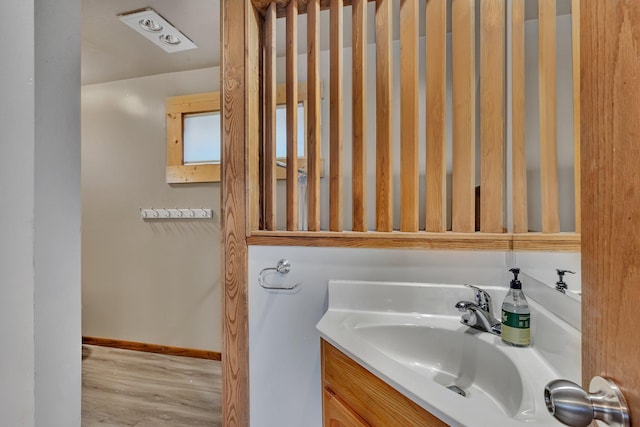 bathroom featuring vanity and hardwood / wood-style flooring