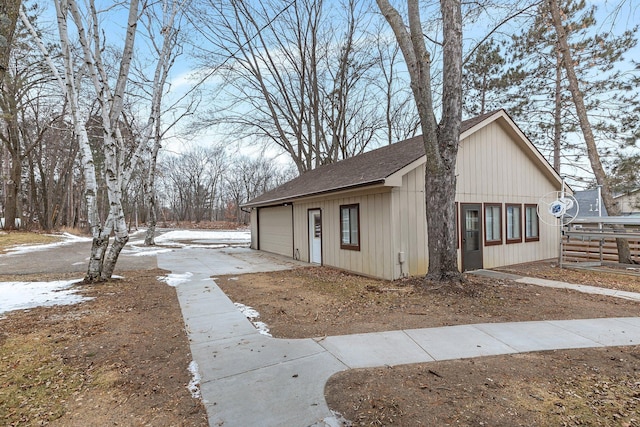 view of property exterior with a garage