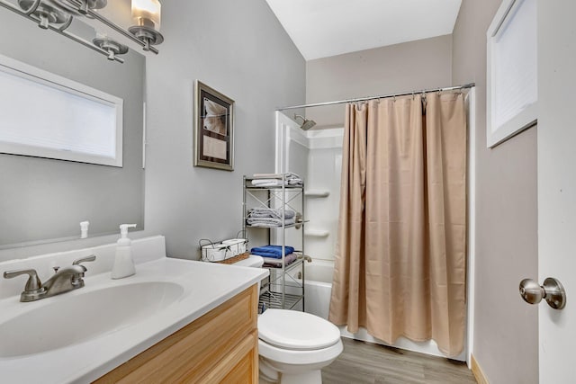 full bathroom with toilet, vanity, shower / bath combo, and hardwood / wood-style flooring