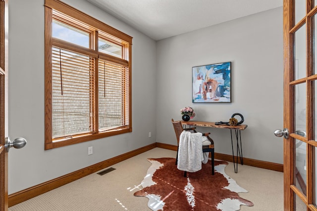 home office featuring visible vents, baseboards, carpet flooring, and french doors