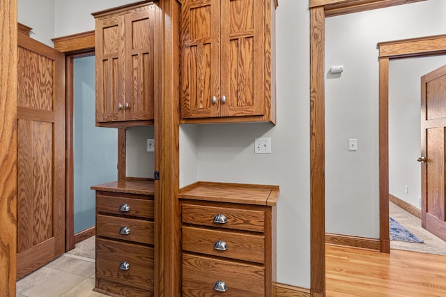 interior details with baseboards and wood finished floors