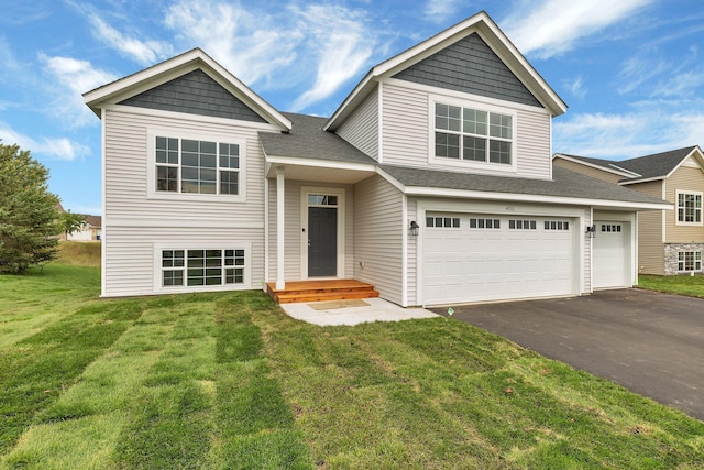 view of front facade featuring a front lawn and a garage