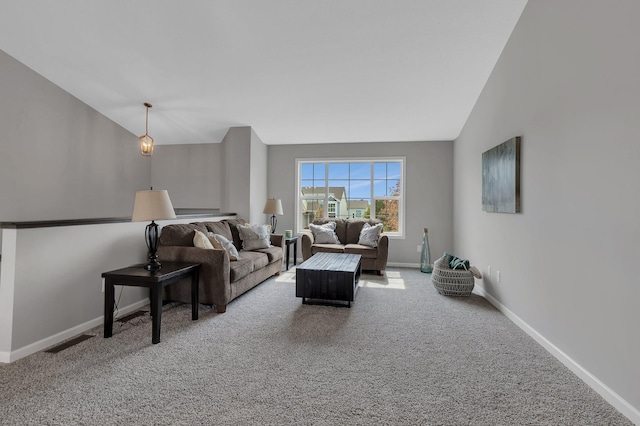 living room with lofted ceiling and carpet