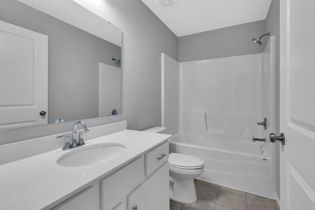 full bathroom with shower / bathing tub combination, tile patterned flooring, vanity, and toilet