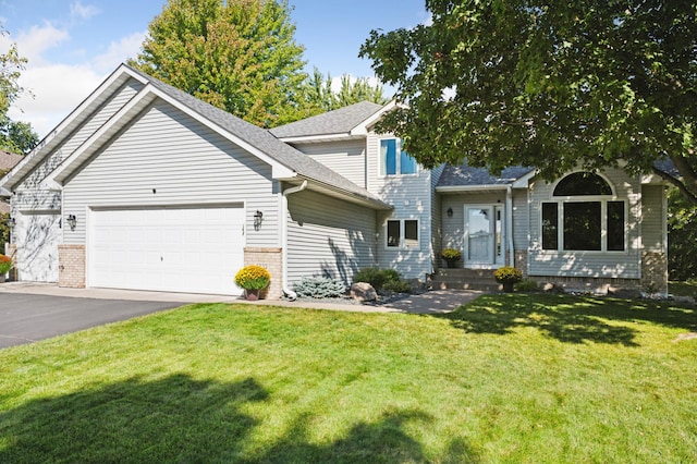 view of front facade featuring a garage and a front lawn