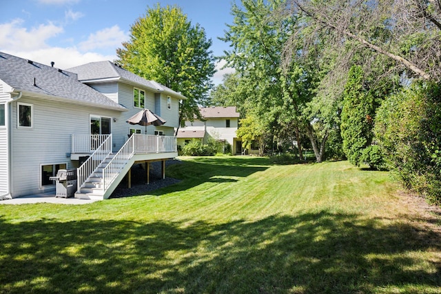 view of yard with a wooden deck