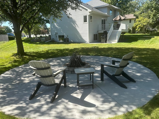 view of patio / terrace featuring an outdoor fire pit and central air condition unit