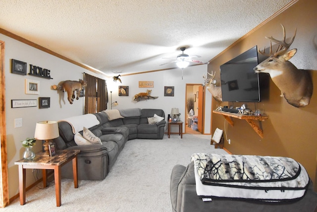 carpeted living room with ornamental molding, ceiling fan, and a textured ceiling