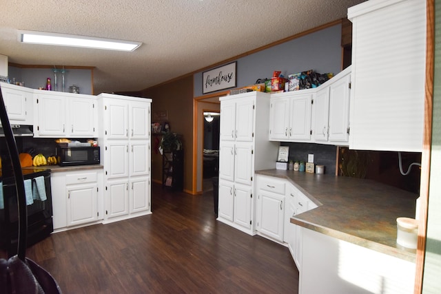 kitchen with a textured ceiling, white cabinetry, crown molding, and decorative backsplash