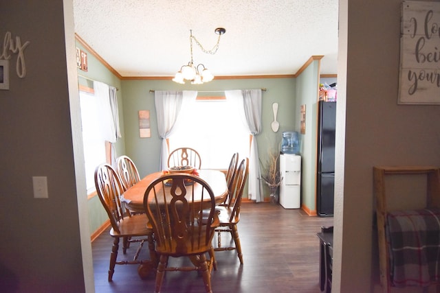 dining space with a chandelier, ornamental molding, and dark wood-type flooring