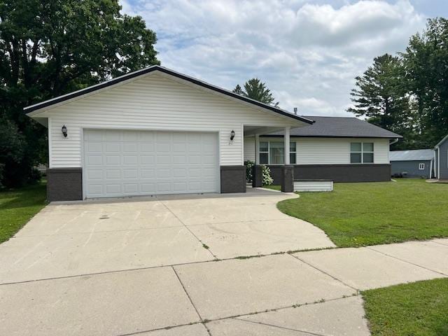 view of front facade with a front lawn and a garage