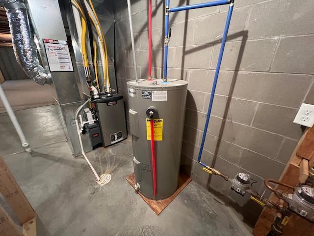 utilities featuring electric water heater and heating unit