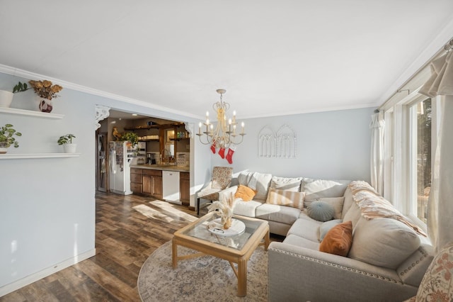 living room with crown molding, dark hardwood / wood-style floors, sink, and an inviting chandelier