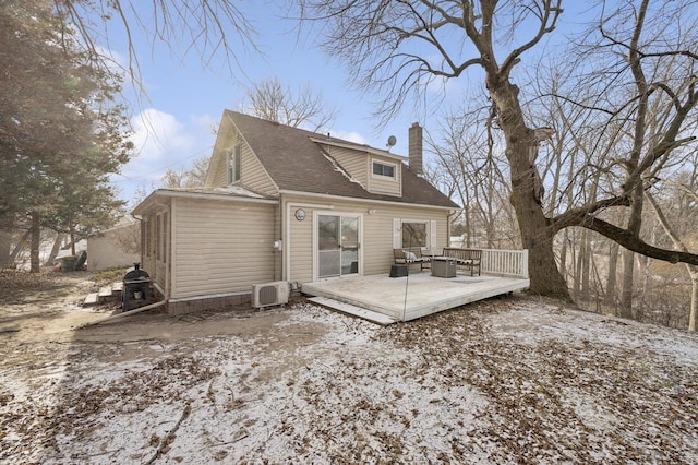 back of property with a wooden deck