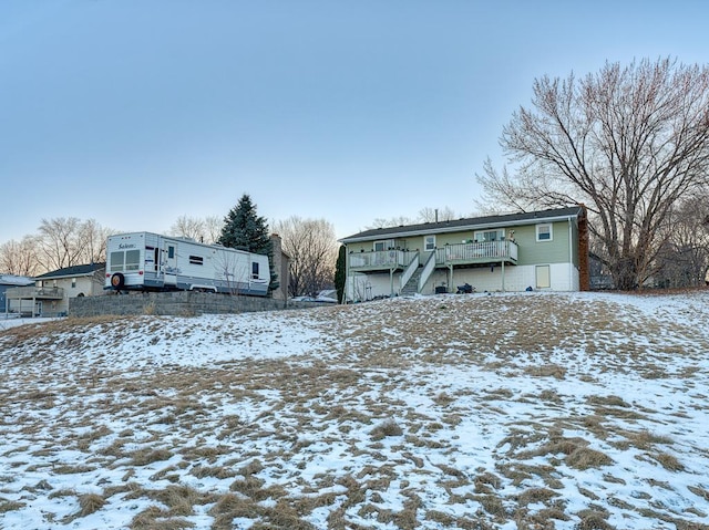 view of front of home with a wooden deck