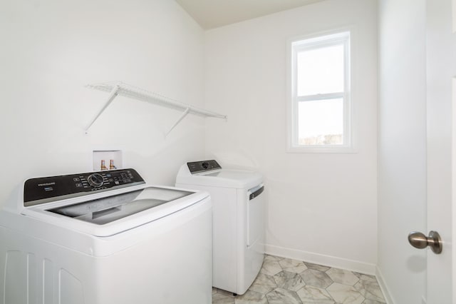 laundry area with separate washer and dryer