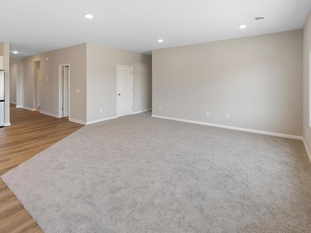 spare room featuring light hardwood / wood-style flooring