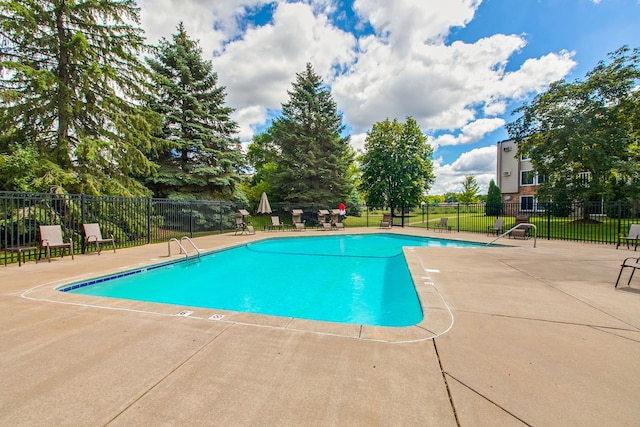 view of pool featuring a patio