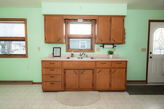 kitchen with sink and a baseboard radiator