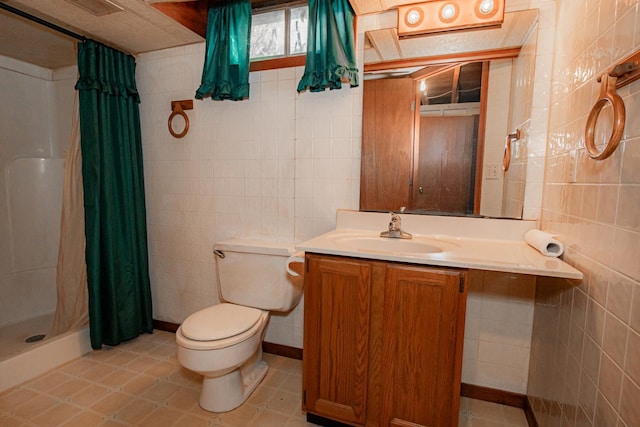 bathroom with toilet, vanity, tile walls, and curtained shower