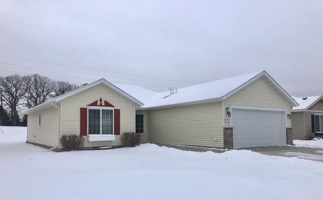 single story home featuring a garage