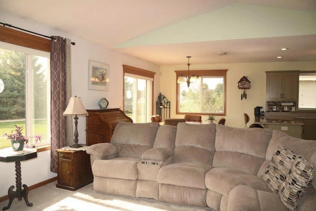 living room with lofted ceiling and light colored carpet