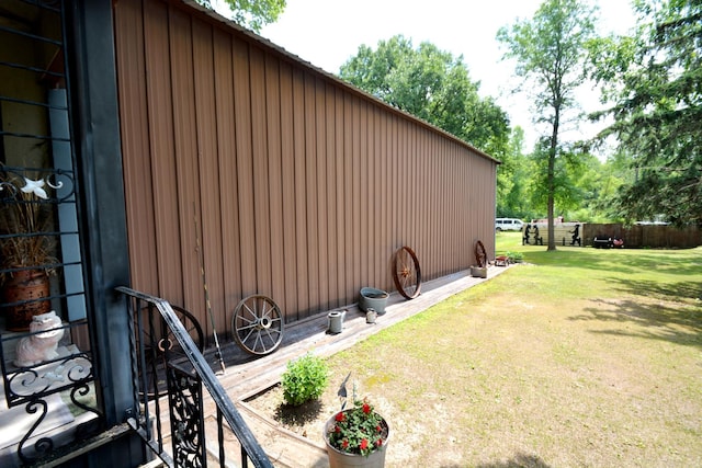 view of property exterior featuring a lawn