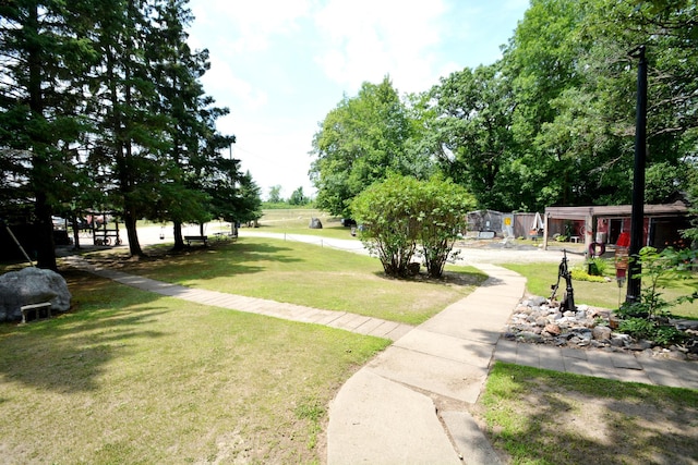 surrounding community featuring a yard