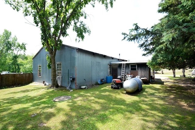 back of house with a yard