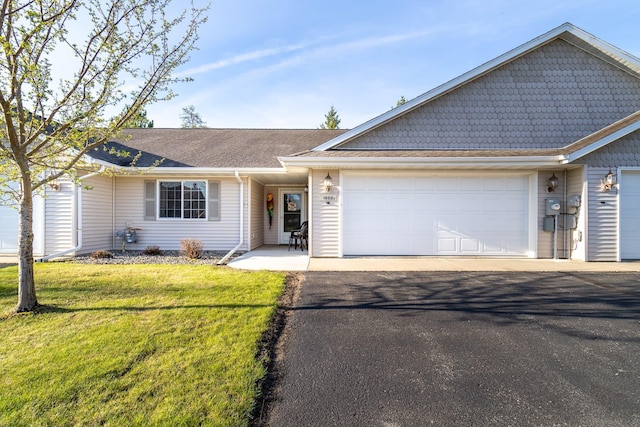 ranch-style house with a front lawn and a garage